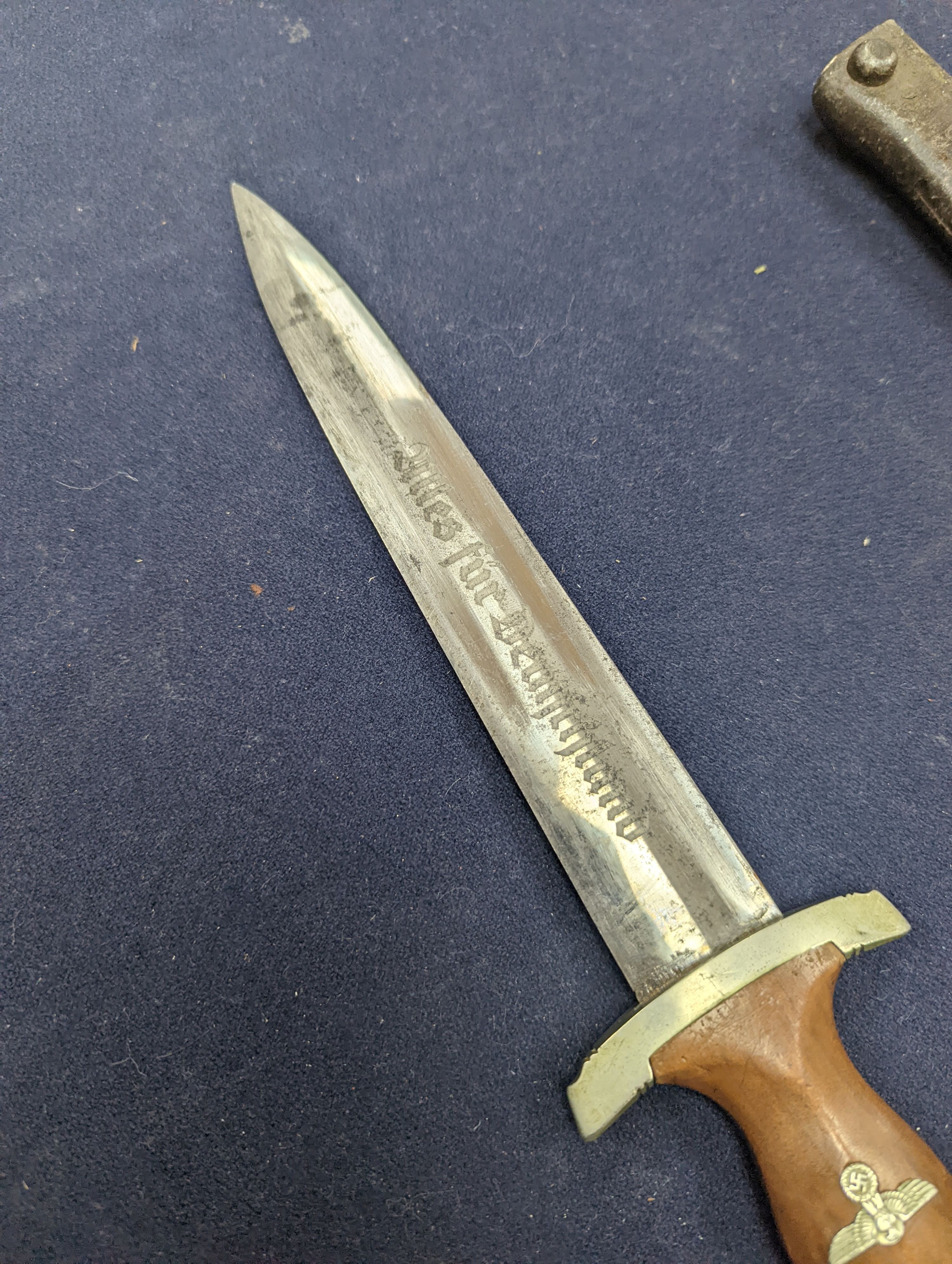 A Third Reich SA dagger within sheath, blade 22cm., and a bayonet within scabbard